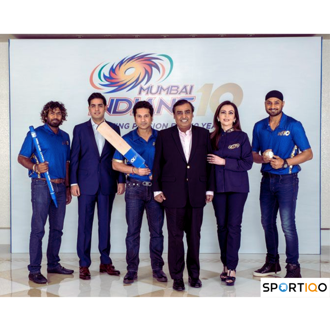 Mumbai Indians owner Mukesh Ambani with his family and players of the team